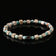 files/FrontviewofAmazoniteIronMeteoriteandWhiteEmperorStoneZenbraceletformen4mmsquarebeadsonblackbackground.webp